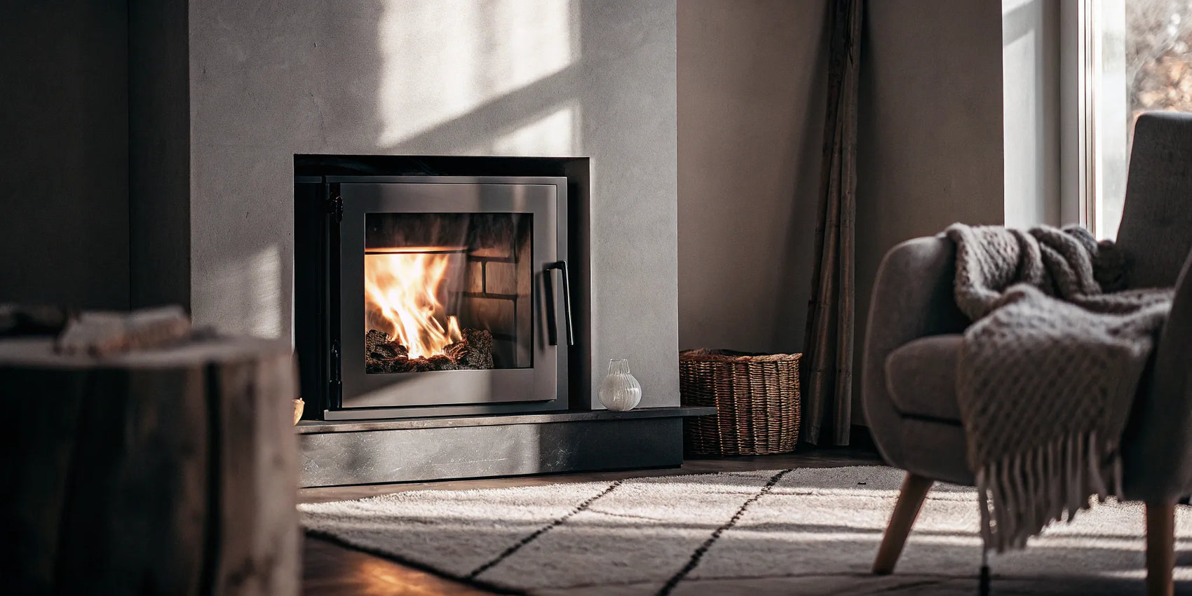 Modern fireplace featuring a new replacement glass panel.