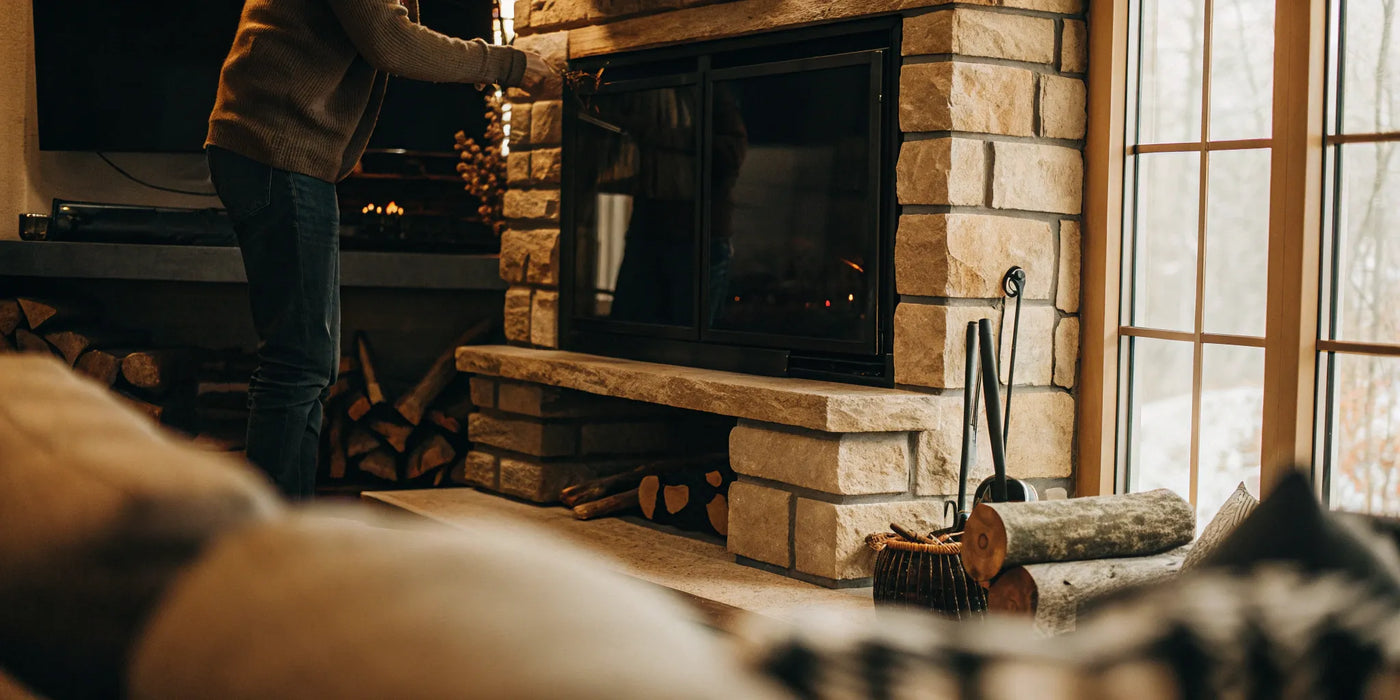 A fireplace with a ceramic glass door, a key factor in the total replacement price.