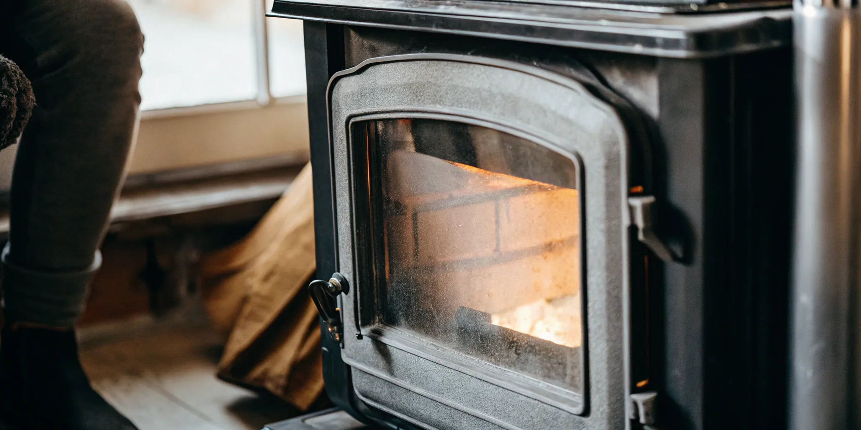 A new flat wood stove gasket creating a safe and efficient airtight seal on a door.