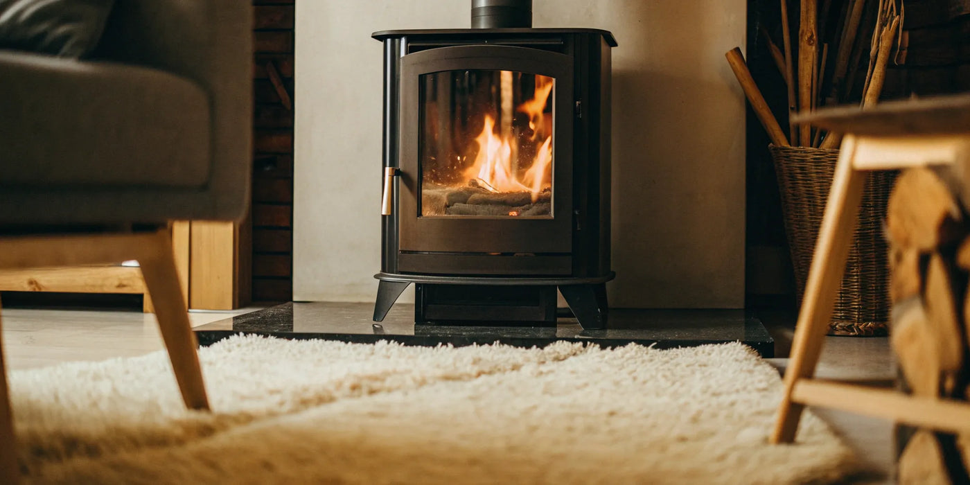 High temperature glass in a stove door with bright orange flames visible inside.