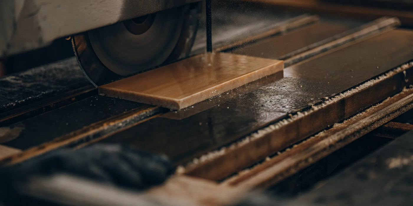 Using a wet saw to make a precise cut on ceramic fireplace glass.